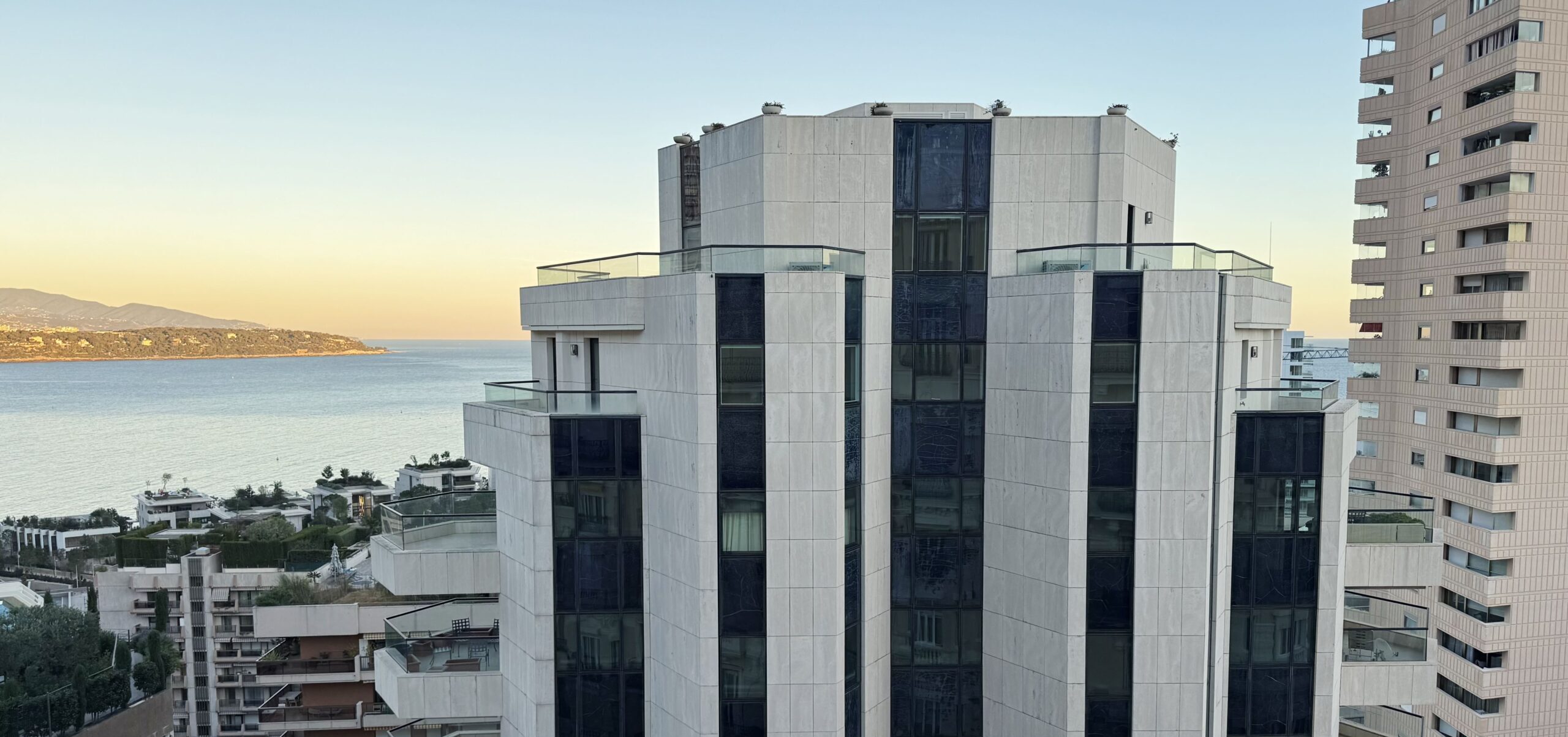 Prince de Galles residential tower at sunset with Mediterranean Sea and French Riviera coastline views in Monaco