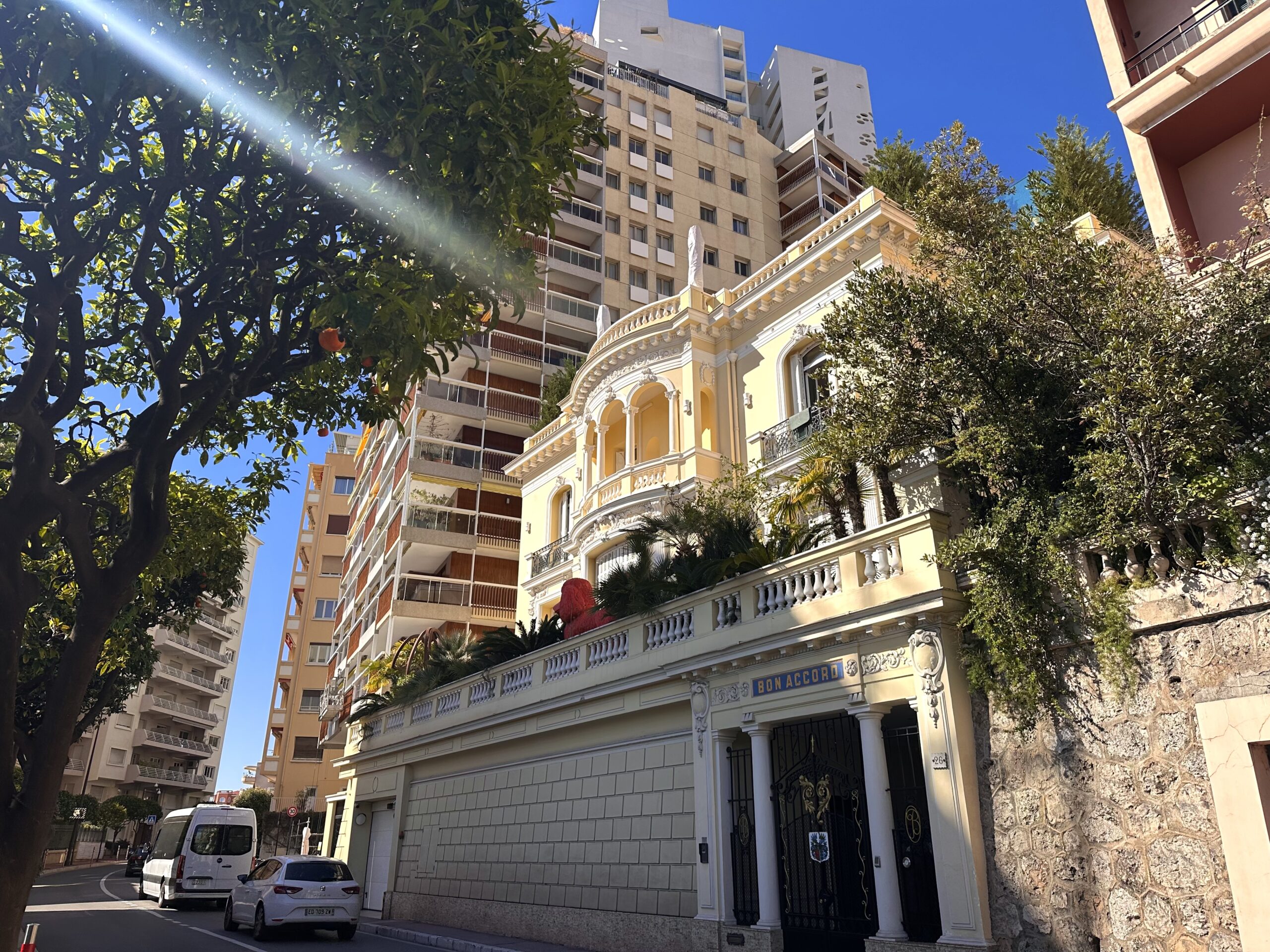 Palais Bosio iconic blue domed tower viewed from a Moneghetti street in Monaco, a landmark building where apartments come up for sale and rent.