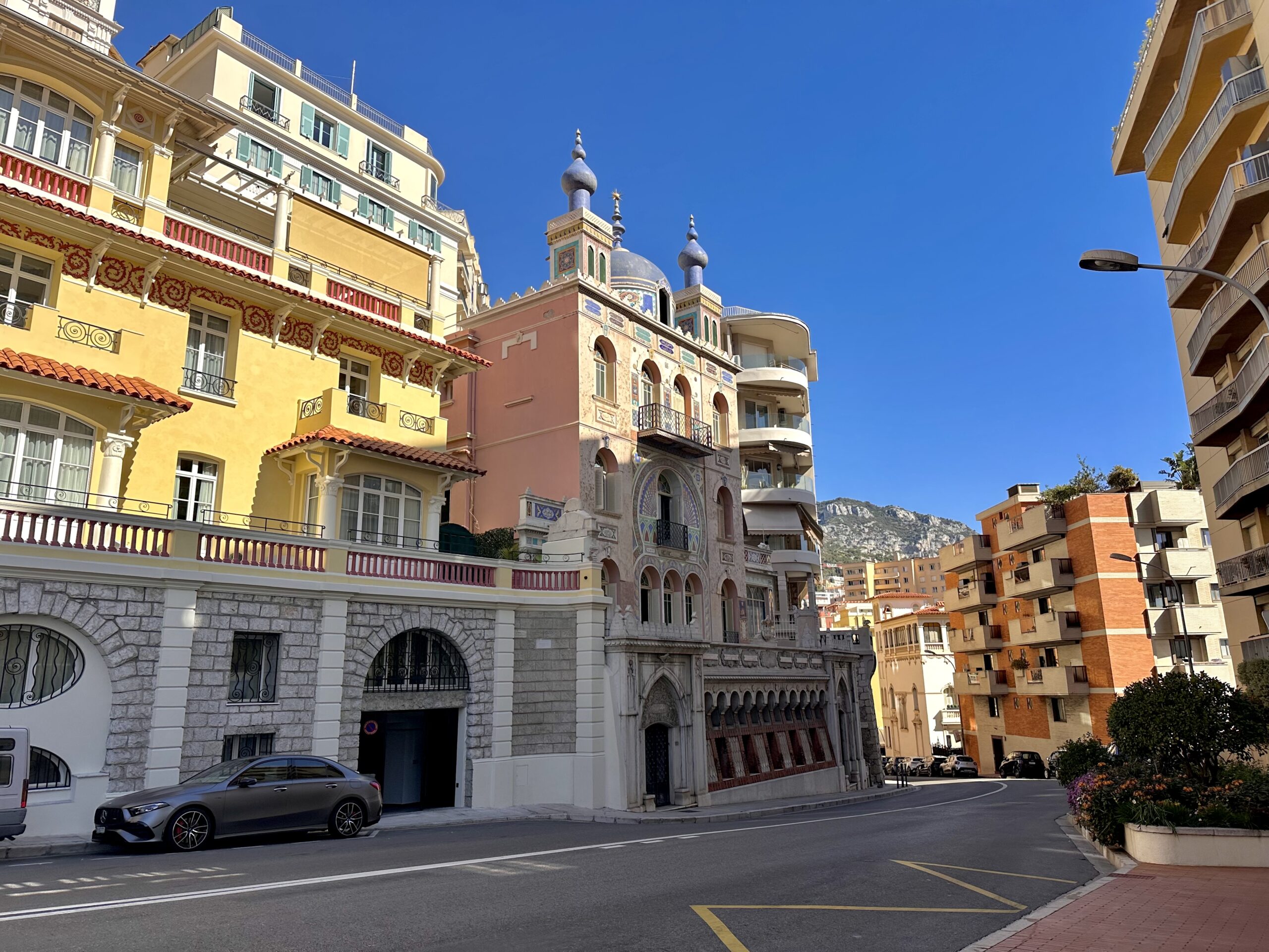 Palais Bosio iconic blue domed tower rises above Boulevard du Jardin Exotique in Monaco, a landmark building where apartments come up for sale and rent