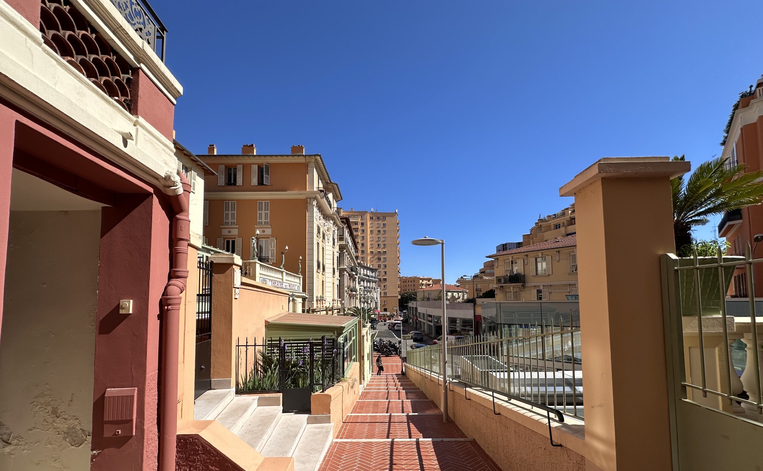 Quiet residential street in Moneghetti Monaco with colourful Belle Époque buildings and apartment blocks for sale and rent