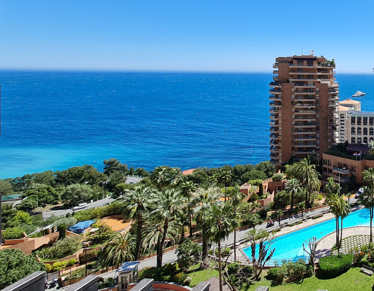 La Rousse Saint Roman neighbourhood in Monaco with luxury residential tower, communal pool and panoramic Mediterranean Sea views, prime real estate district