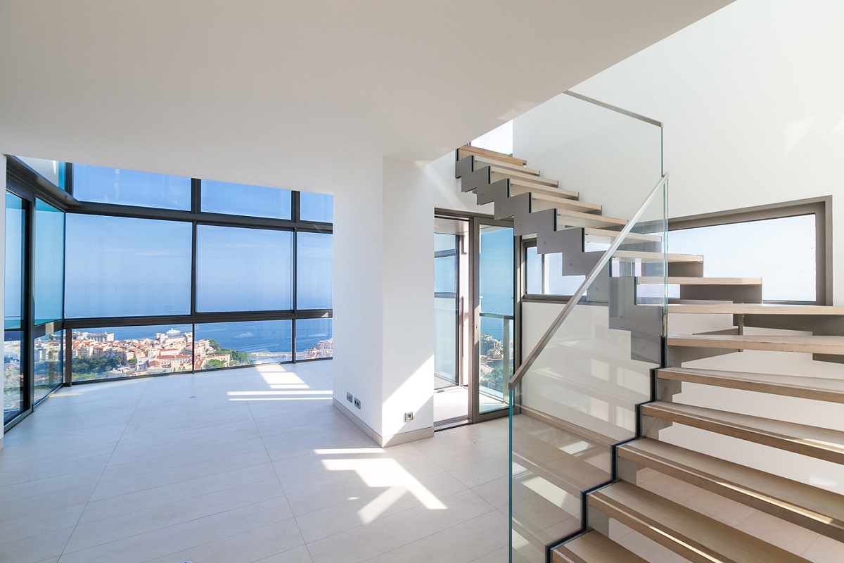 Modern apartment with large glass windows in Monte Carlo view building