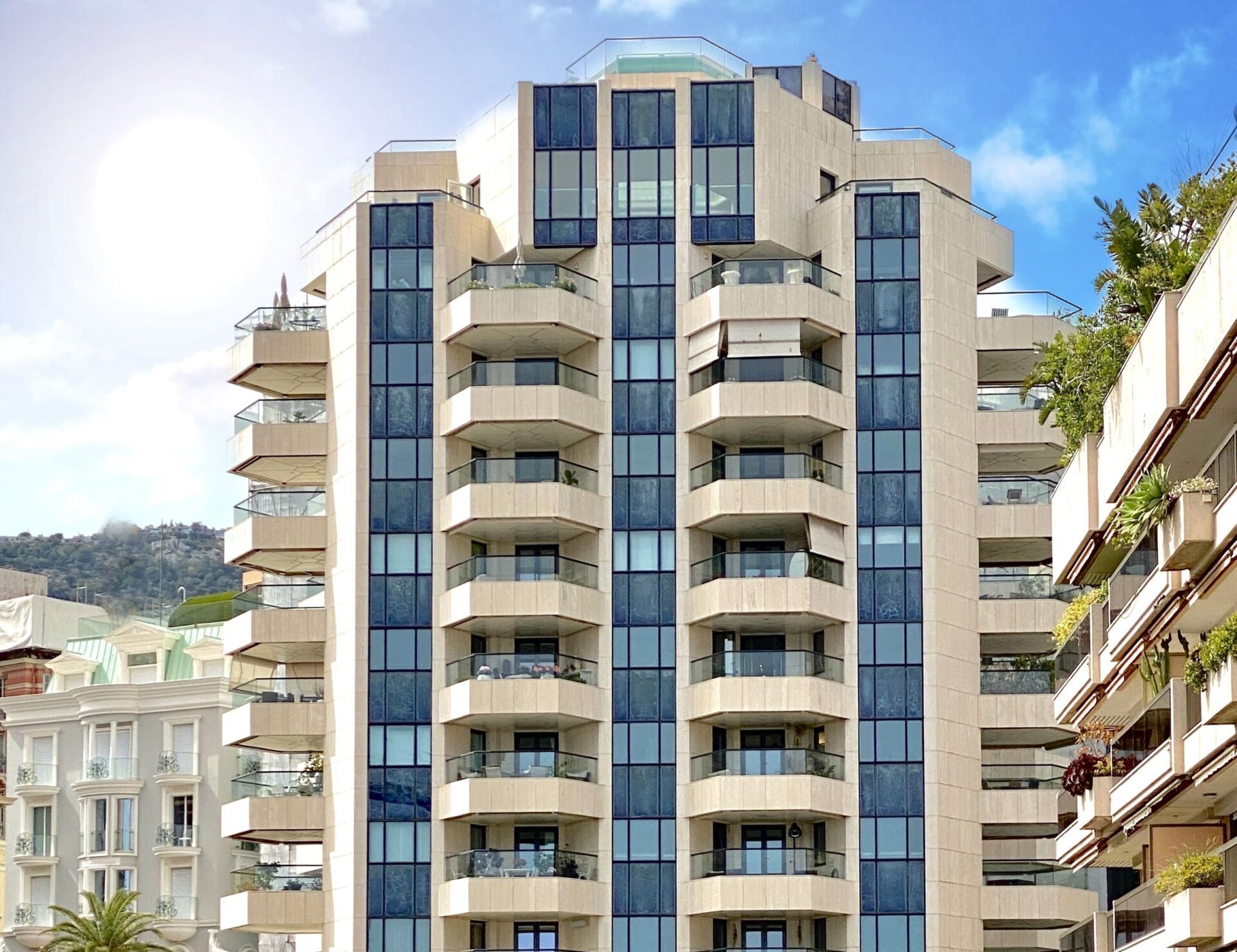 Prince de Galles modern residential tower with curved glass balconies in Monte-Carlo Monaco, apartments for sale and rent in Prince de Galles