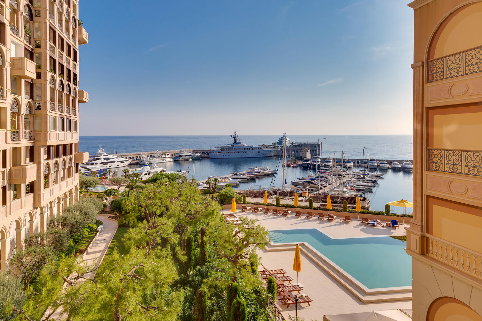 View from Les Terrasses du Port Monaco over the outdoor pool and Port Hercule