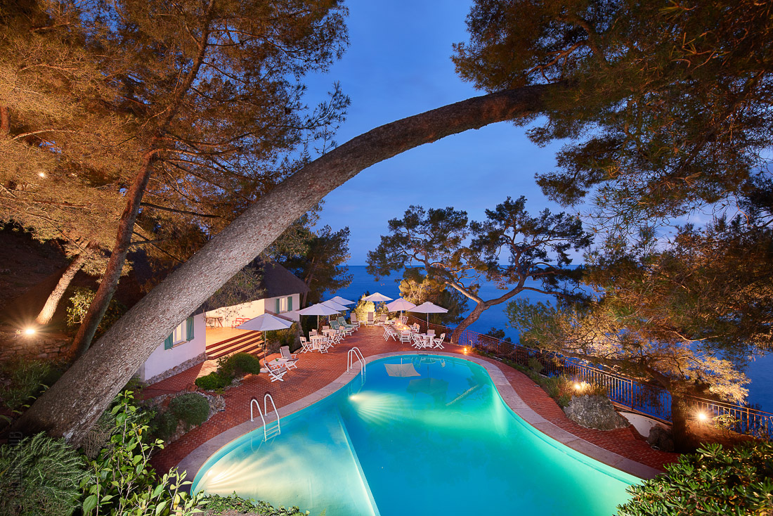 Villa Lygie illuminated private pool and outdoor terrace at night with sea views, luxury rental Roquebrune-Cap-Martin near Monaco