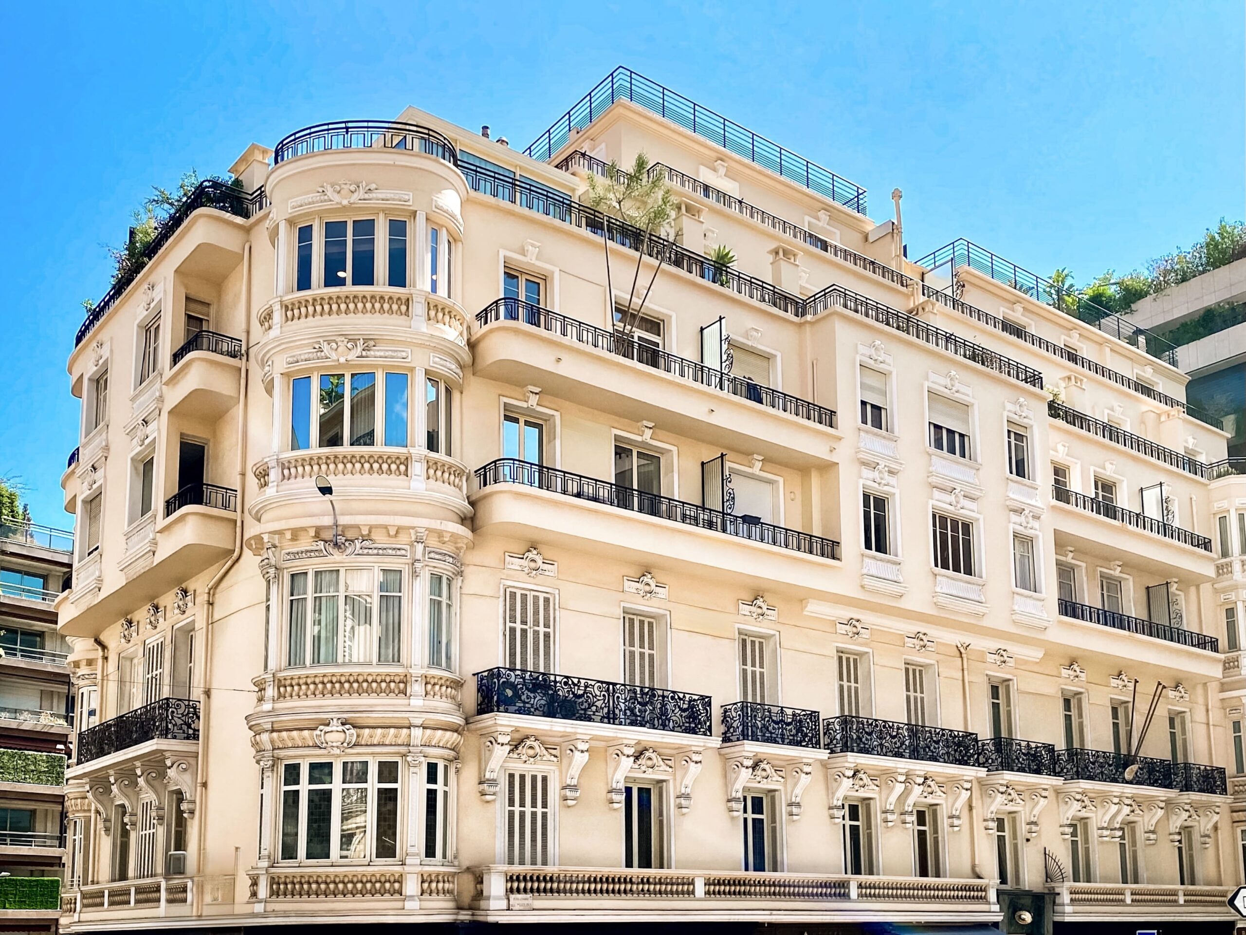 Winter Palace Monaco is a grand Belle Époque residential building with ornate balconies and rooftop terrace, one of Monte-Carlo's most recognisable addresses for apartment buyers and renters