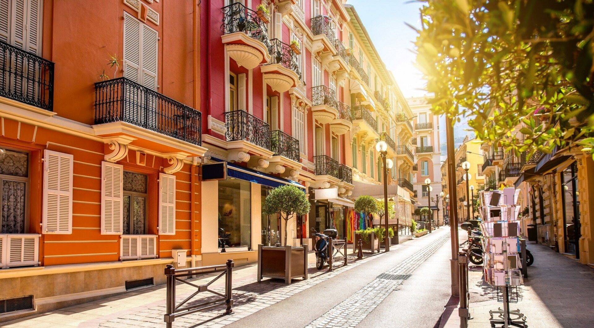 La Condamine neighbourhood colourful Belle Époque street with boutique shops and wrought iron balconies, vibrant district in Monaco