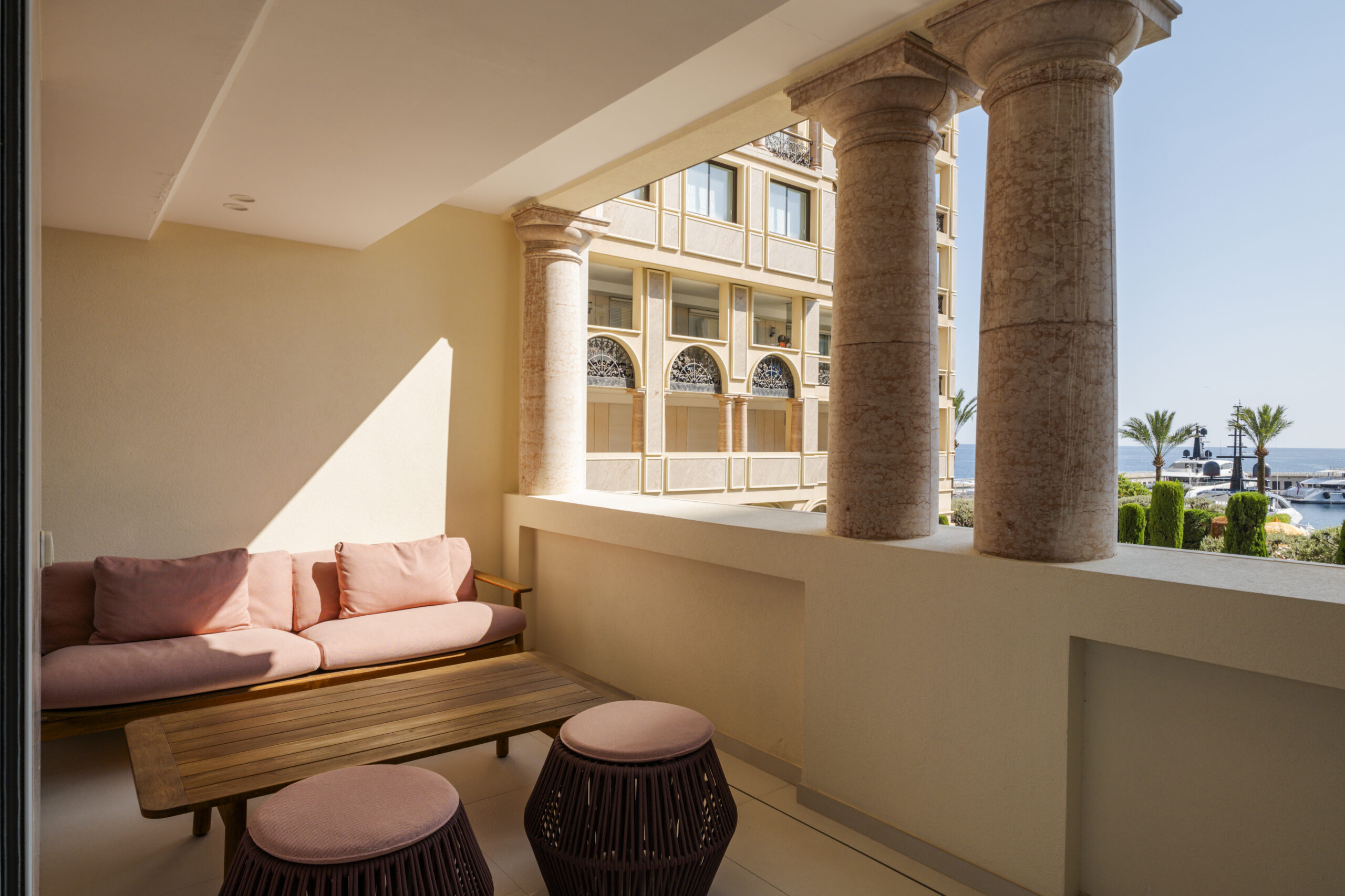Seaside Plaza apartment balcony with travertine columns, outdoor seating and superyacht views, 3 bedroom apartment for sale in Monaco