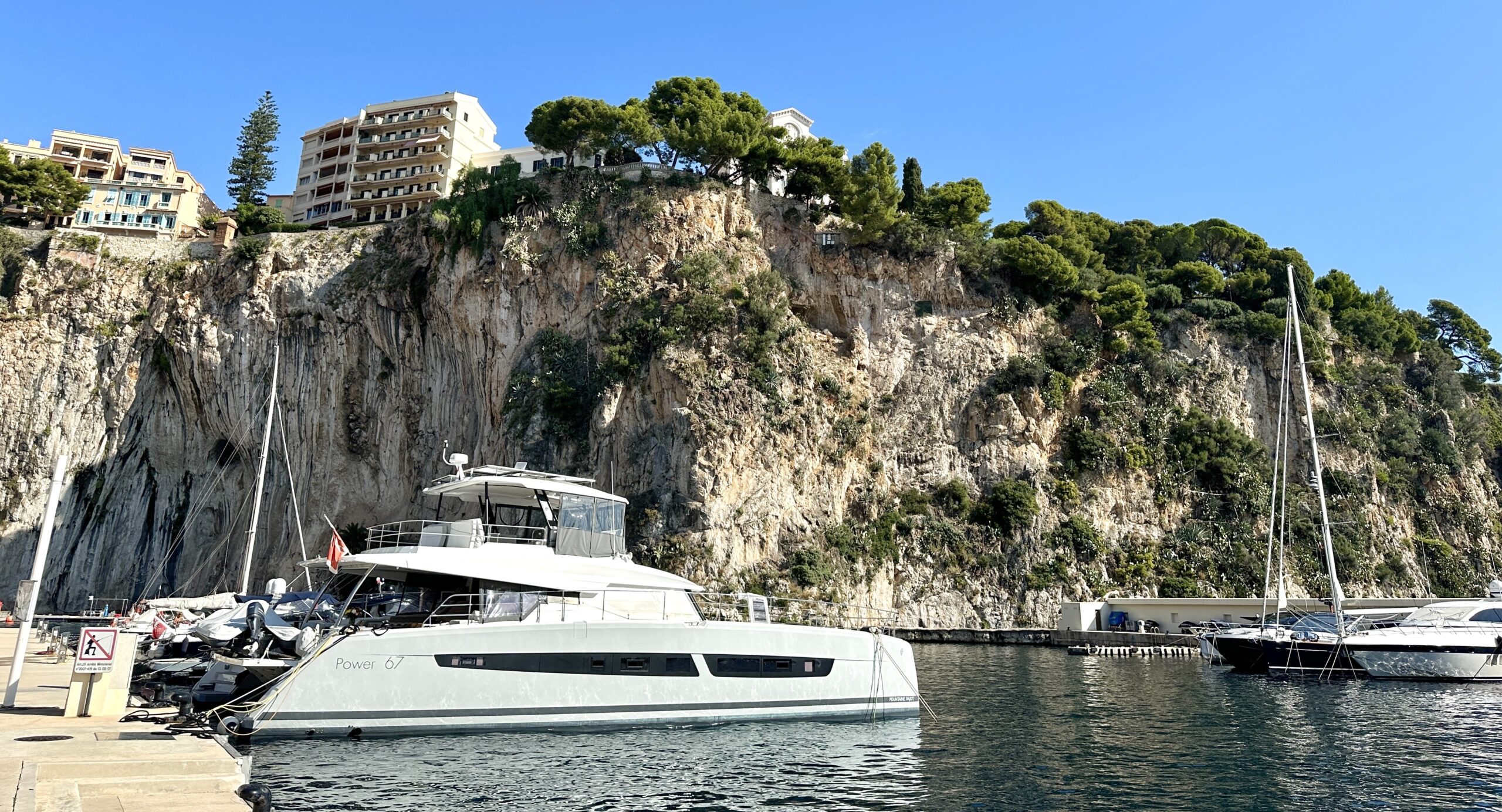 Fontvieille view of the Rocher and castle, and a boat