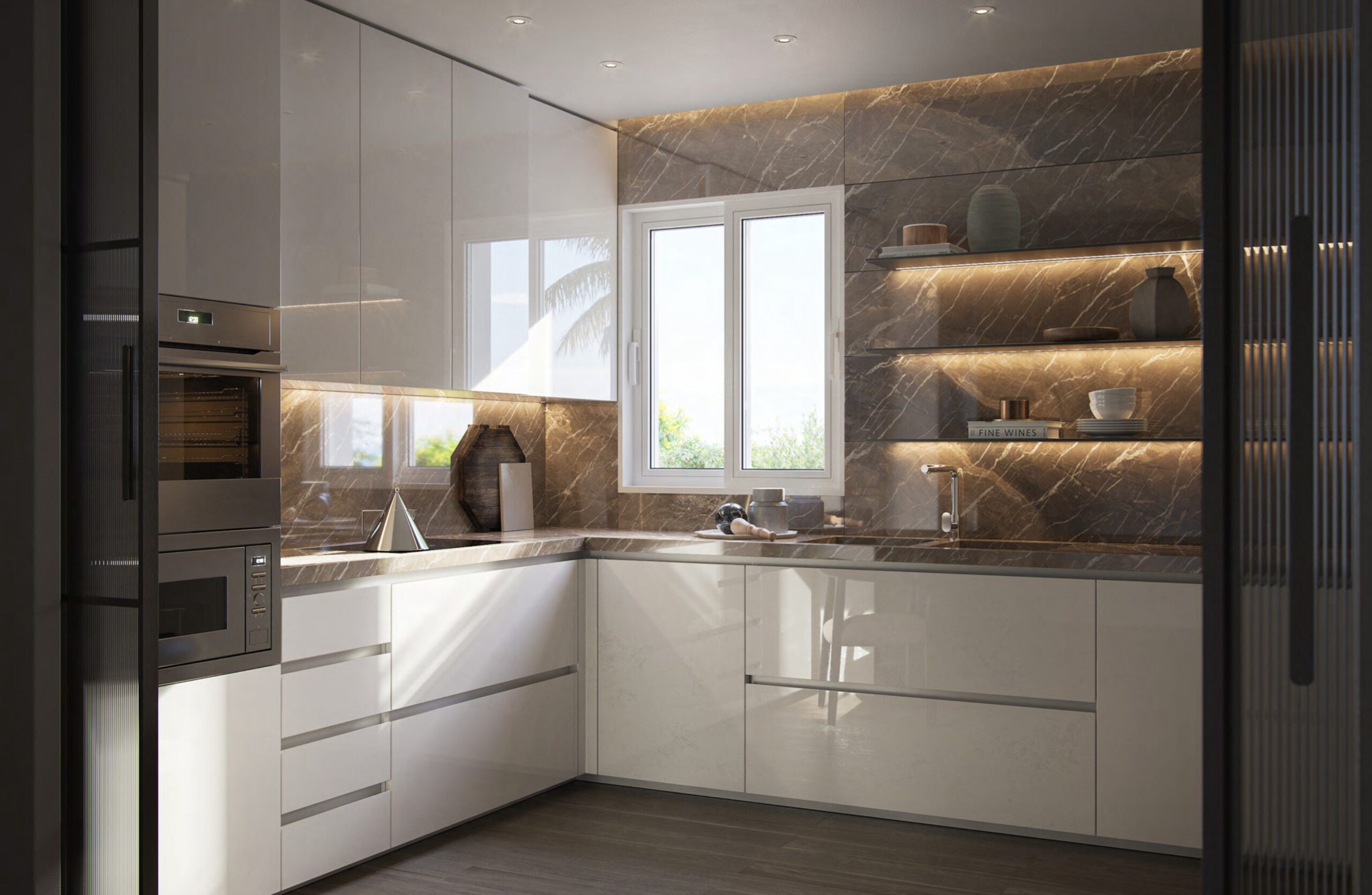 Kitchen at Villa Annonciade Monaco with gloss white units and dark marble splashback.