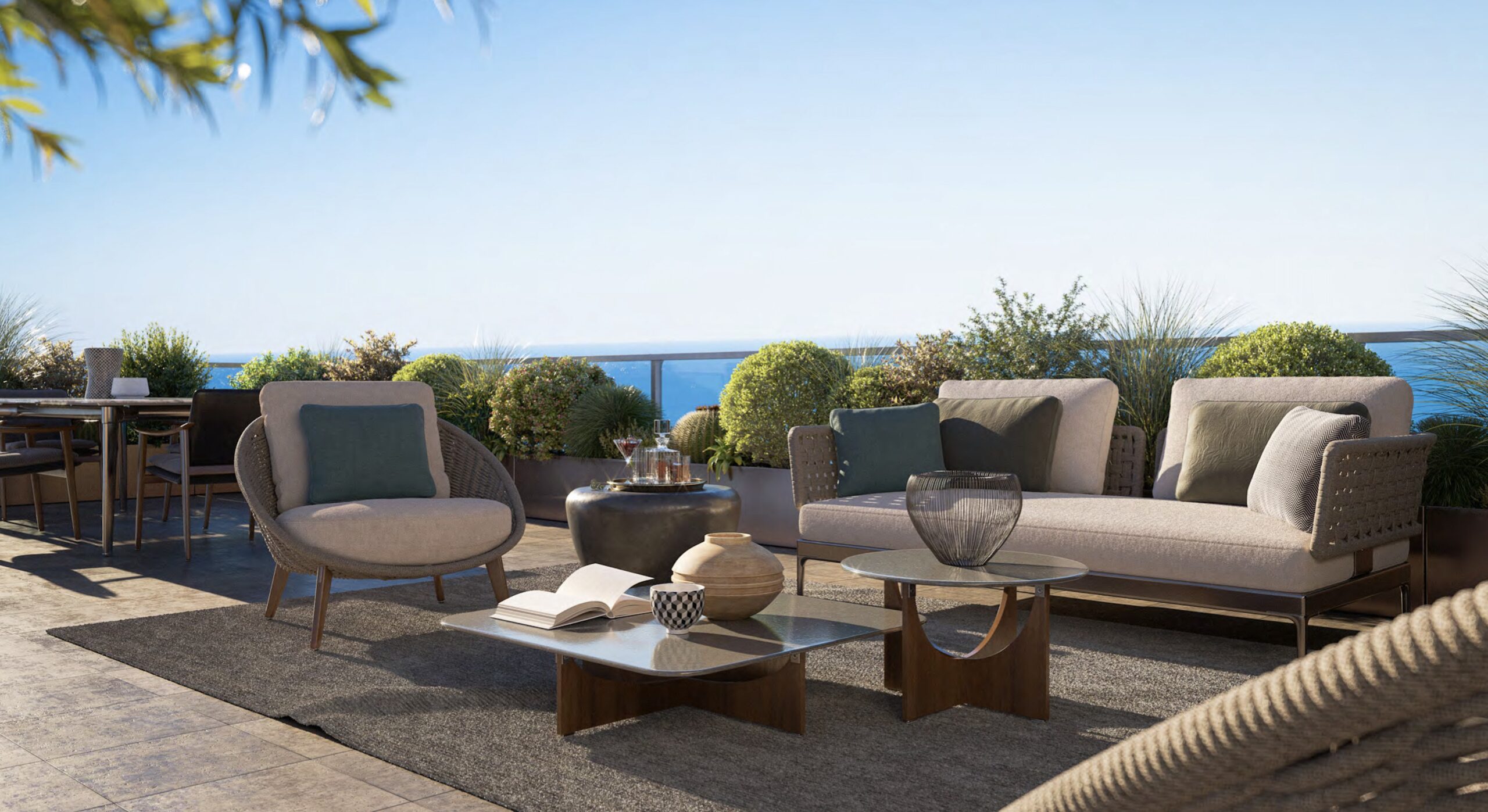 Landscaped terrace at Villa Annonciade Monaco with outdoor lounge seating and sea view
