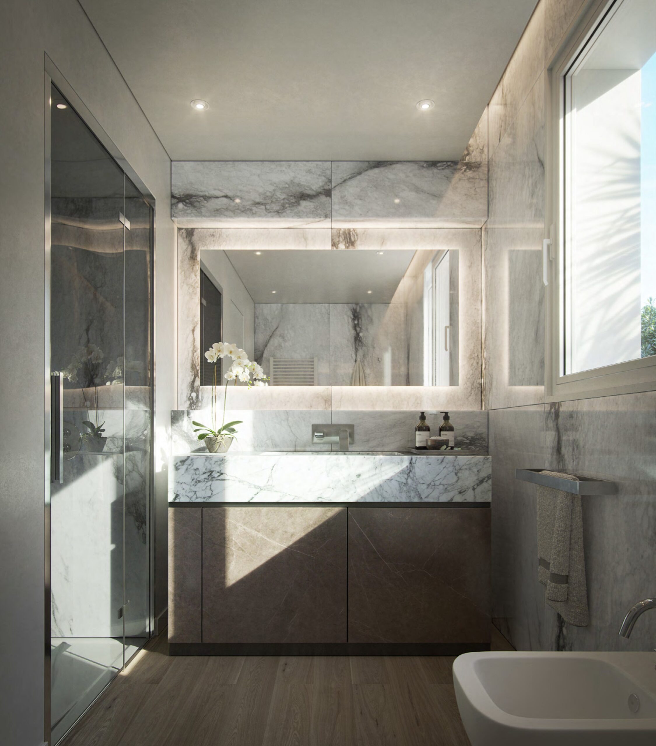 Marble bathroom at Villa Annonciade Monaco with backlit mirror and glass shower