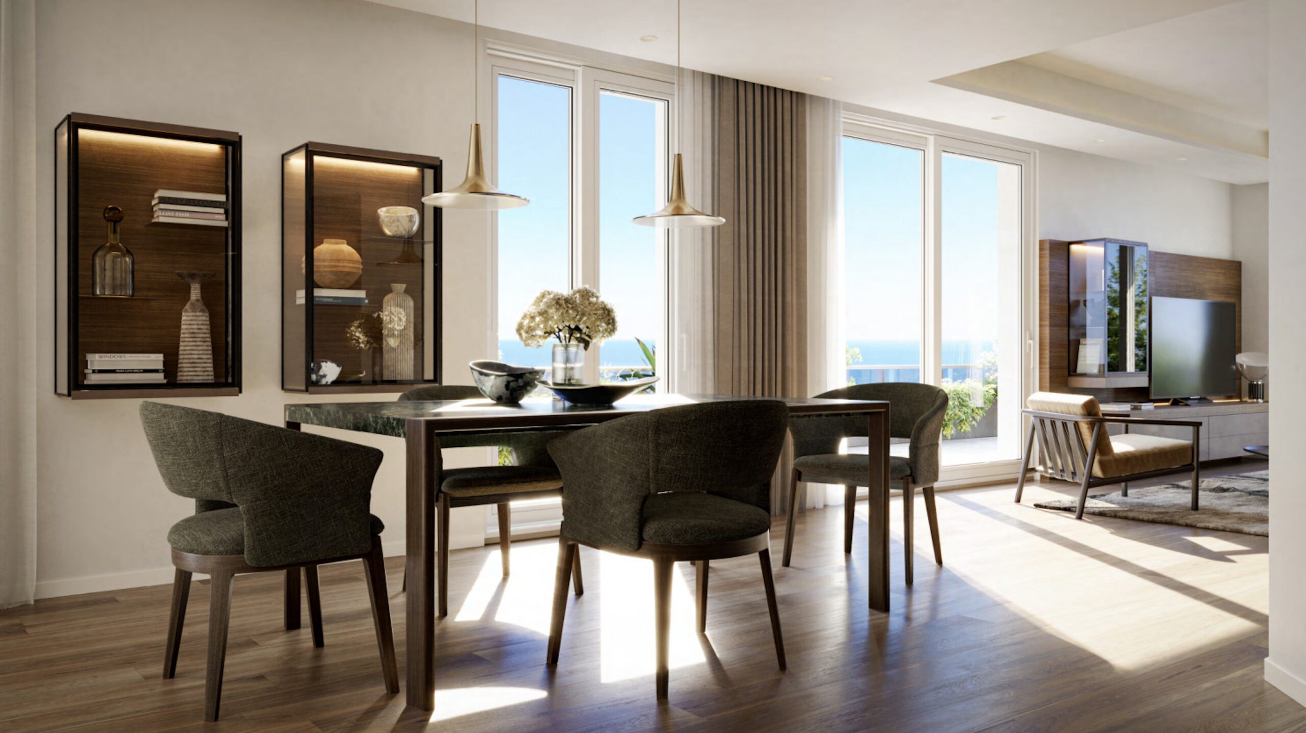 Open plan dining room at Villa Annonciade Monaco with pendant lights and sea view windows