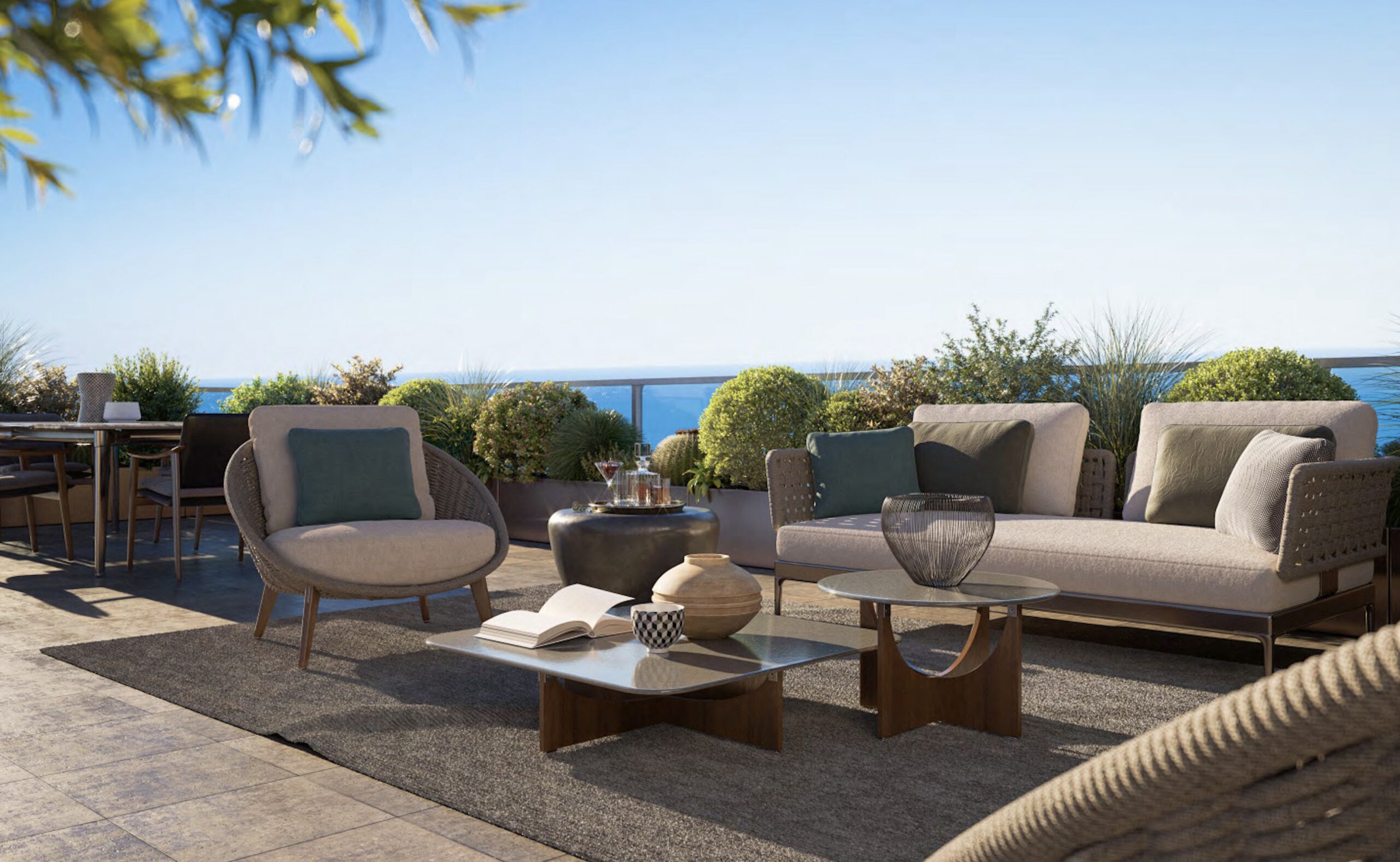 Landscaped terrace at Villa Annonciade Monaco with outdoor lounge seating and sea view